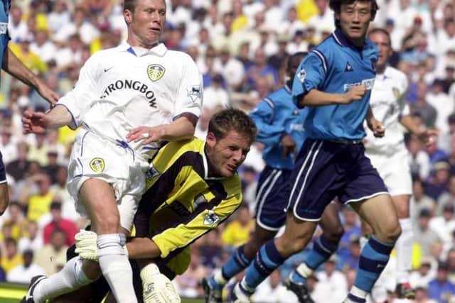 GET IN: Nick Barmby gets ahead of Manchester City keeper Carlo Nash to put Leeds 1-0 ahead on August 17, 2002.