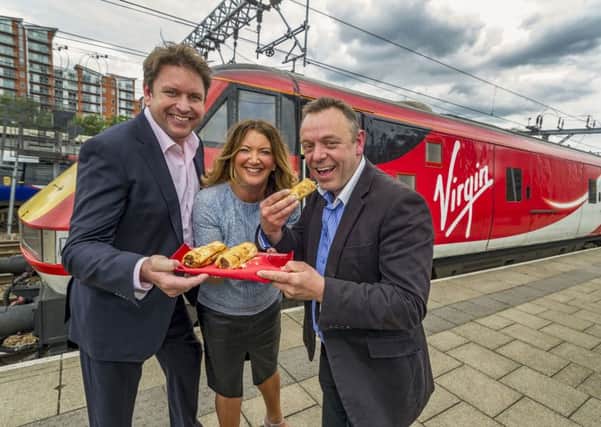 Date: 21st June 2016. Picture James Hardisty.
Virgin Trains executive chef James Martin, with one of the Yorkshire suppliers James Wright, from Taste Tradition based in Ripon and Ali Watson, Director of Customer Experience at Virgin Trains East Coast at Leeds City Station to promote the new First Class menu on the service.