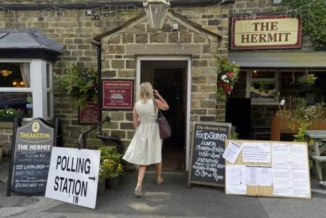 A voter enters a polling station