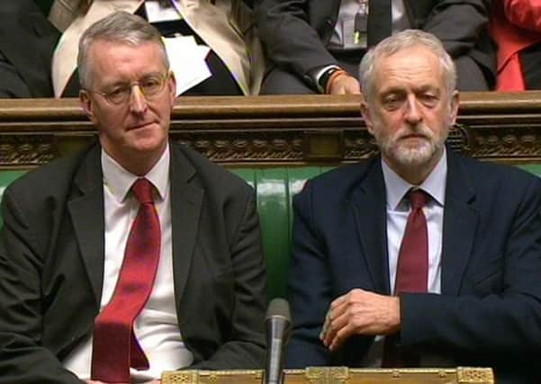 Labour Party leader Jeremy Corbyn (right) and former Shadow foreign secretary Hilary Benn who he has sacked after he raised concerns about his leadership.