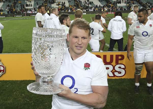 England's Dylan Hartley holds the Cooks cup after his side's win over Australia in Sydney. Picture: AP/Rob Griffith.