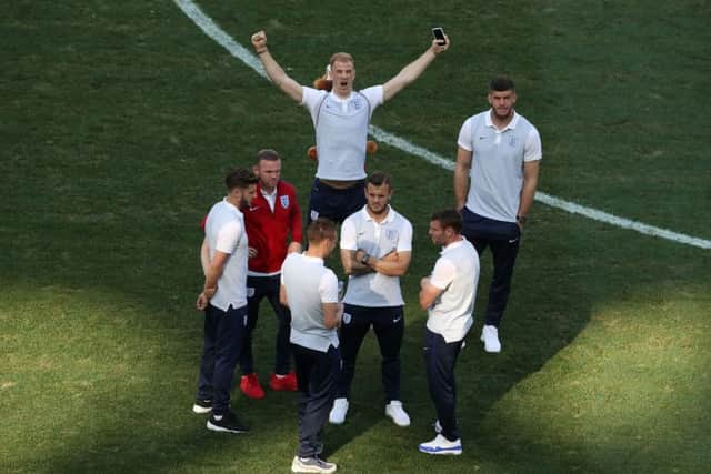 England's Joe Hart with a toy lion on his back alongside team-mates during a stadium walkaround at the Stade de Nice. Picture: Owen Humphreys/PA.