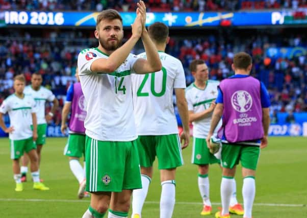 Stuart Dallas salutes the fans after Northern Ireland's defeat to Wales.
