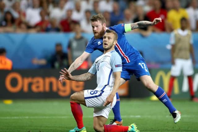 England's Jack Wilshere attempts to block a shot from Iceland's Aron Gunnarsson. Picture: PA.