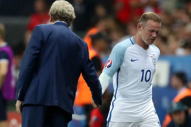 England's Wayne Rooney (right) shakes hands with  manager Roy Hodgson after being substituted against Iceland. Picture: Owen Humphreys/PA