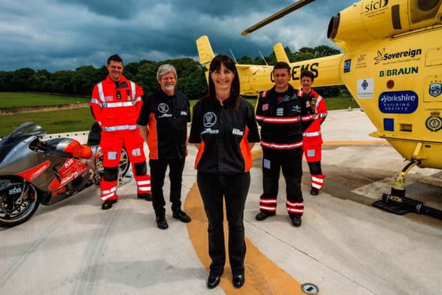 Becci Ellis and husband Mick (left) meet Yorkshire Air Ambulance pilot Captain Garry Brasher (right) and paramedics Matt Syrat and Sammy Wills at Nostell Priory.