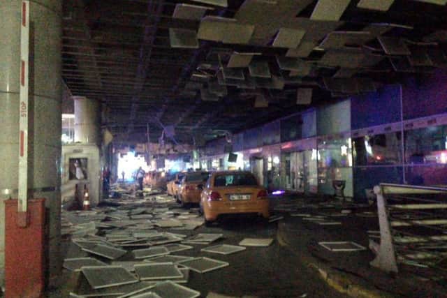 Two explosions have rocked Istanbul's Ataturk airport, killing at least 10 people and wounding around 20 others, Turkey's justice minister and another official said Tuesday.  (DHA via AP)