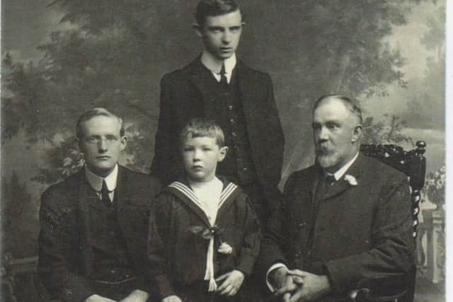 A photo of Whiteley Tolson (left) and his family.