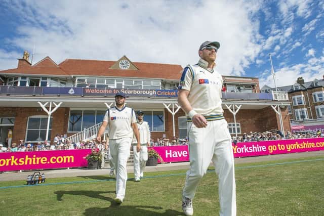 On North Marine parade: Captain Andrew Gale leading the Yorkshire team out against Durham at Scarborough last year.