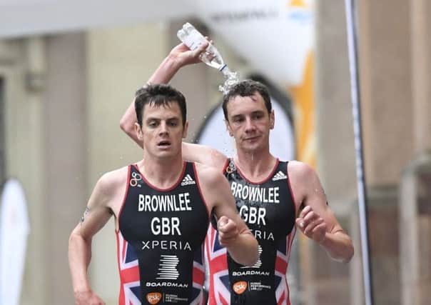 Brothers Jonathan, left, and Alistair Brownlee of Britain during the 2016 during the ITU World Triathlon Series in Stockholm. (Pontus Lundahl/TT via AP)