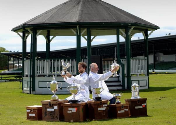 Edward Smith with his son Joseph are cleaning the trophies for the Great Yorkshire Show.  Pictures: Simon Hulme
