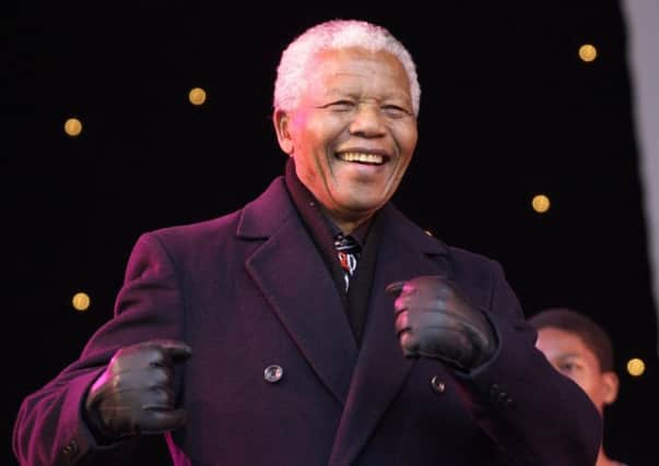 APRIL 2001: Nelson Mandela dances to the Leeds crowd during one of the performances from Ladysmith Black Mambazo.