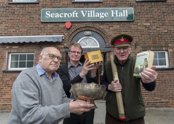 Members of Seacroft Local History Group, with, centre, Boff Whalley, and some of the items already collected in preparation for the show.