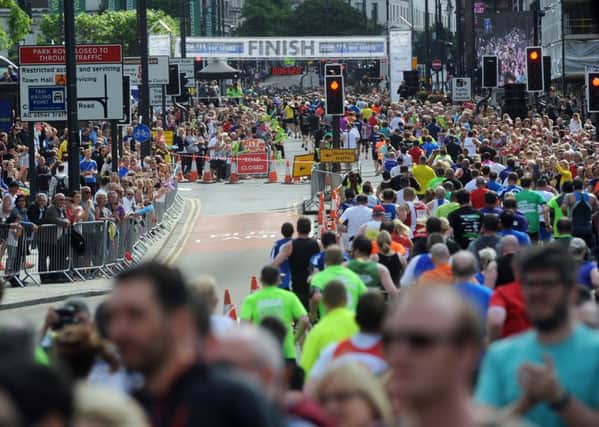 Crowds gathered on The Headrow to watch runners in the 2015 Jane Tomlinson Run for All Leeds 10K.