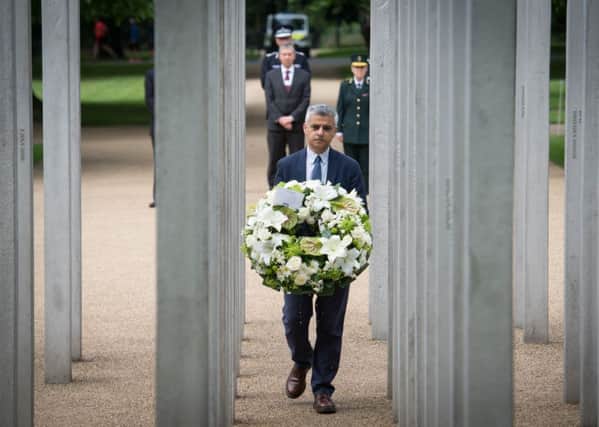 London Mayor Sadiq Khan lays a wreath at the memorial in Hyde Park to mark the 11th anniversary of the 7/7 terrorist attacks on London. 
Photo: Stefan Rousseau/PA Wire