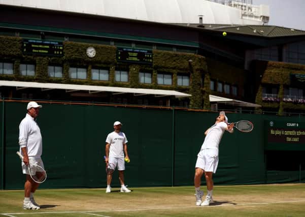 Andy Murray and Ivan Lendl (left) during a practice session on Thursday at Wimbledon. Pictures: John Walton/PA.