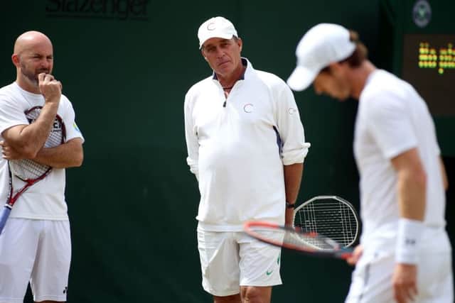 Andy Murray's coaches Jamie Delgado (left) and Ivan Lendl (centre) watch on during a practice session. Picture: Steve Paston/PA.