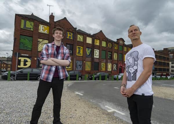 The Lyons Works building with Paul Brough and Ian Fulcher, two of the students who worked on the project.