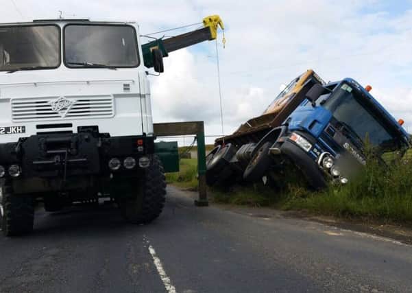 The recovery operation gets under way after an HGV overturned. Picture: @WYP_RPU