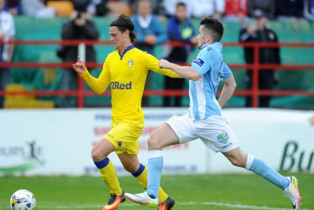 Leeds United's Marcus Antonsson takes on Shelbourne's Dylan Kavanagh. 
Picture: Jonathan Gawthorpe