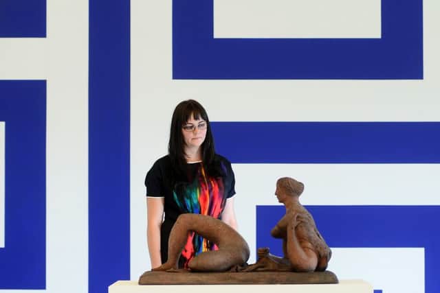 BLUE: Rachel Graves is pictured with Reclining Figure by F.E. McWilliam, in front of Renovation Renovation Filter Lobby Diagram by Liam Gillick. PIC: Scott Merrylees