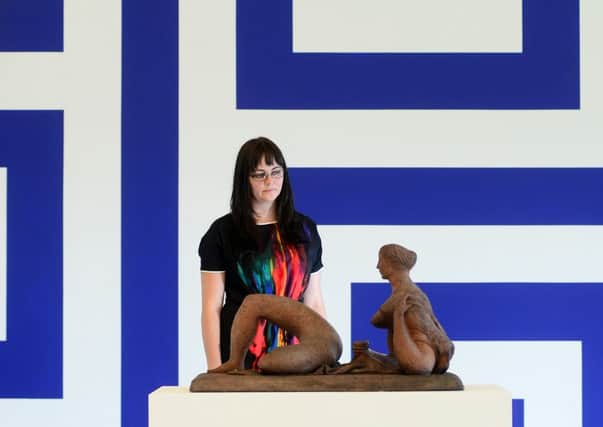 BLUE: Rachel Graves is pictured with Reclining Figure by F.E. McWilliam, in front of Renovation Renovation Filter Lobby Diagram by Liam Gillick. PIC: Scott Merrylees