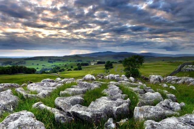 Picture Post:Looking across to Ingleborough from the limestone outcrops above Stainforth as the sun go's down. 12 July 2016.  Picture Bruce RollinsonTECH DETAILS: Nikon D4, Nikkor 24-70,  100th sec @ f8, 400asa.