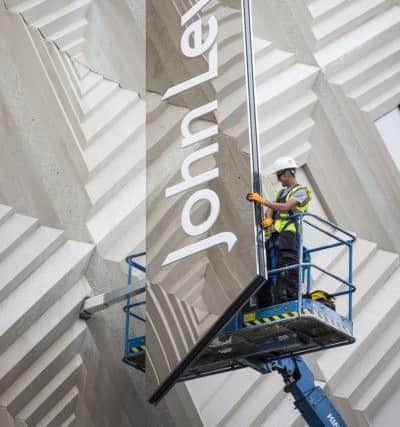 ©Andrew McCaren/AM images 14/07/2016 Leeds UK. Picture shows the John Lewis sign being installed onto the side of the new store on the Headrow in Leeds.