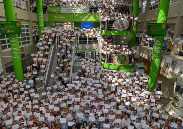 Asda colleagues show their support for the #HelloMyNameIs campaign.