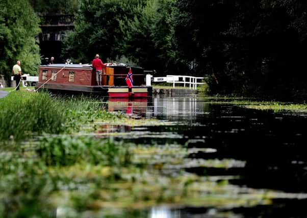 Date: 24th August 2015, (JH1010/01a) Possible Picture Post.......A couple along with their narrow boat stop just before Lock 3 at St Ann Ings Lock on the Leeds & Liverpool Canal on their onward journey through the centre of Leeds. 
Camera Details: Nikon D3's Lens VR 70-200mm, Aperture f/3.5, Shutter Speed 1/500s, ISO 200.