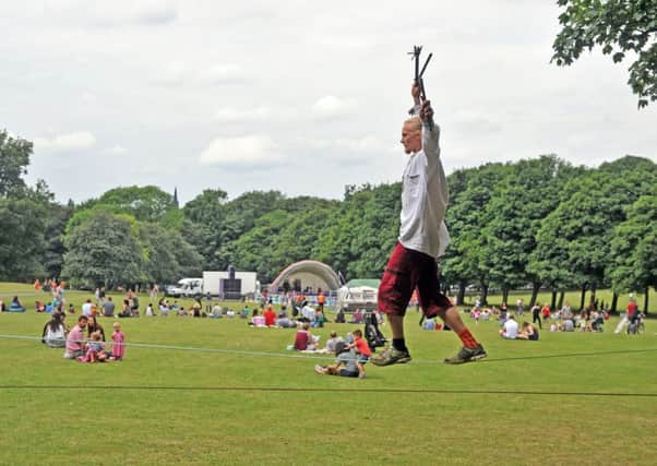 Sam Thomas works on his circus skills at the annual Unity Day in Hyde Park, Leeds. Pictures: Tony Johnson.