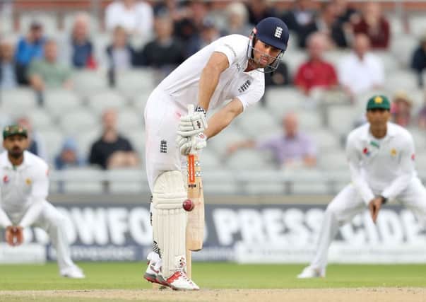 England's Alastair Cook hits out against Pakistan on day three at Old Trafford. Picture: Martin Rickett/PA.
