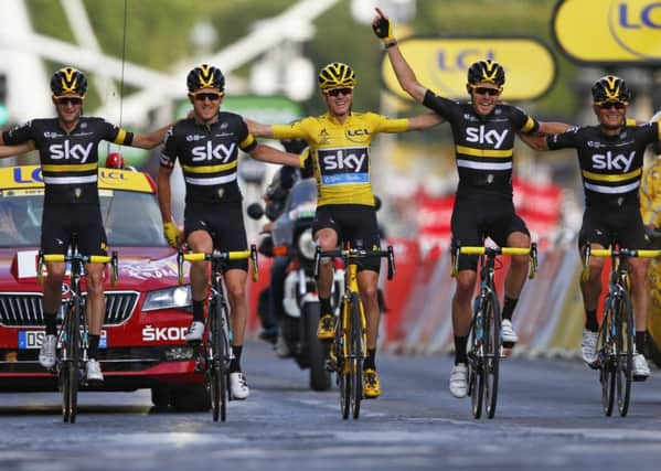 2016 Tour de France winner Chris Froome of Britain and his Sky teammates cross the finish line in Paris. Picture: AP/Peter Dejong.