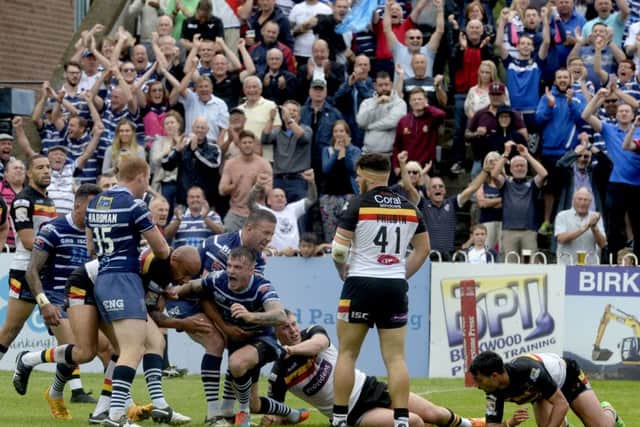 MAGIC MOMENT: Featherstone Rovers' players celebrate Anthony Thackeray's try against Bradford Bulls on Sunday. Picture James Hardisty.