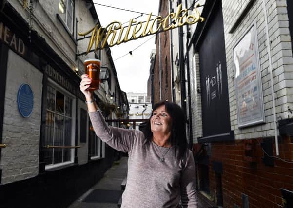 Barmaid of 33 years Kim Shires gets ready for the Whitelock's Beer Festival. Pictures: Jonathan Gawthorpe.