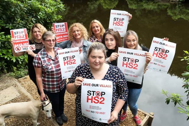 OPPONENTS: The campaigners pictured at Howell Wood.
