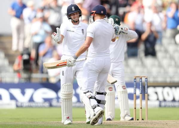 England's Joe Root celebrates his 250 against Pakistan at Old Trafford. Picture: Martin Rickett/PA.