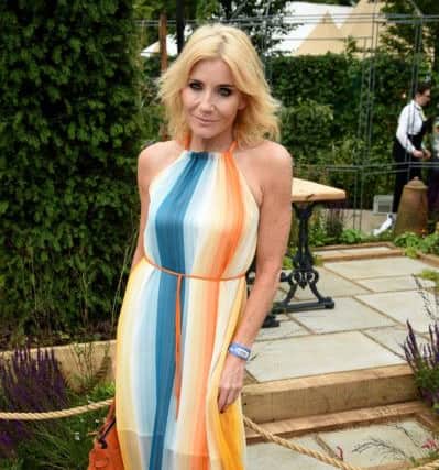 Michelle Collins in a flattering striped maxi at the RHS Hampton Court Palace Flower Show in Surrey.  Andrew Matthews/PA Wire