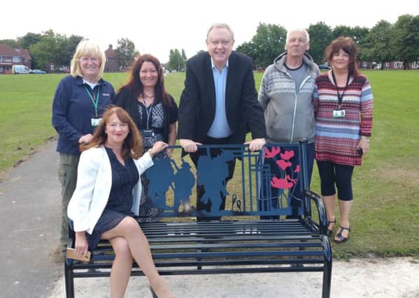 Coun Kim Groves (Lab, Middleton Park - seated) and Coun Paul Truswell (Lab, Middleton Park - middle) pictured with residents at the unveiling of one of the new benches.