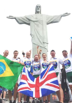 The Ride to Rio team including Mike Tomlinson (right) at the Christ the Redeemer statue in Brazil.