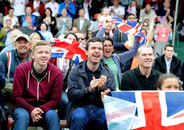 Date: 7th August 2012.
Crowds reacts in Millennium Square, Leeds, during the Olympic Triathon which GB's Alistair Brownlee, won Gold and his brother won Bronze.