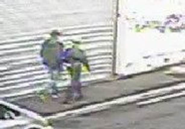 An image captured on CCTV of the people who police want to trace.