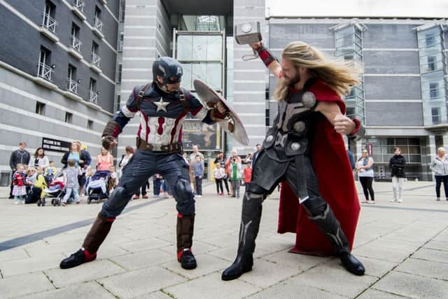 Captain America battling with Thor at the Royal Armouries museum in Leeds.