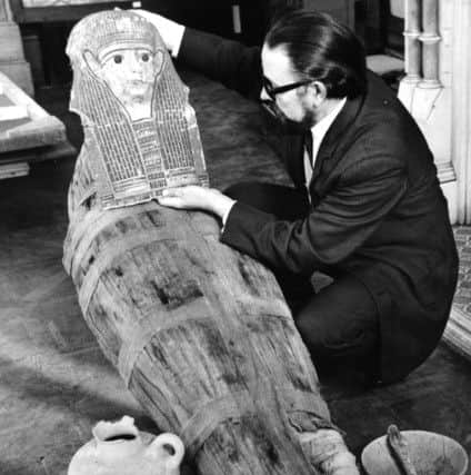 Batley. 20th November 1969.
WITH the aid of a 2,000-year-old funeral mask, several rolls of bandages, wire netting, hardboard and powdered coffeee, a museum expert has produced a realistic-looking mummy.
The construction of this modern mummy was a serious venture carried out to provide the centre-piece for a display of ancient Egyptian antiques which will be a feature of Bagshaw Museum, Batley, now being reorganised.
Mr. John Lidster, curator of Batley Museums and Art Gallery, carried out the reproduction work.
"This job was simply to provide a more graphic display in our Egyptican exhibition. Included in the mummy, besides the old marsk, is part of a mummified leg," he said. "Now both of these items are in perspective."
Mr. Lidster explained that in the museum's possession was a large collection of Egyptian antiques donated between 1920 and 1930.
"When we finished our reorganisation programme and re-open again on January 1 many more of them than formerly will be on view to the public,"he went on.
M