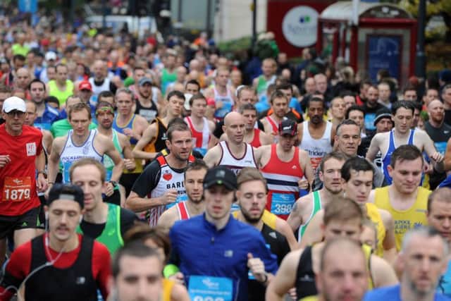 Date:15th November 2015. Picture James Hardisty.  Abbey Dash 2015, pictured Runners making their way along Wellington Street, Leeds.