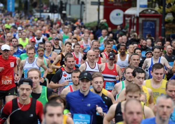 Date:15th November 2015. Picture James Hardisty.  Abbey Dash 2015, pictured Runners making their way along Wellington Street, Leeds.