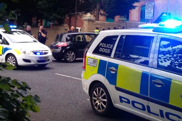 The driver and occupants of the black car ran off after the crash.