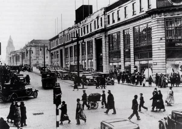 The Headrow, Leeds in the 1930s. The major attraction was Lewis's new department store, opened in September 1932 at a cost of Â£1 million. Its lavish marble floors, bronze decorated staircases, lifts and escalators brought ultra modern style shopping in Leeds.
