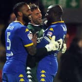 Spot stopper Rob Green celebrates with Kyle Bartley and Sol Bamba.  PIC: Tony Johnson