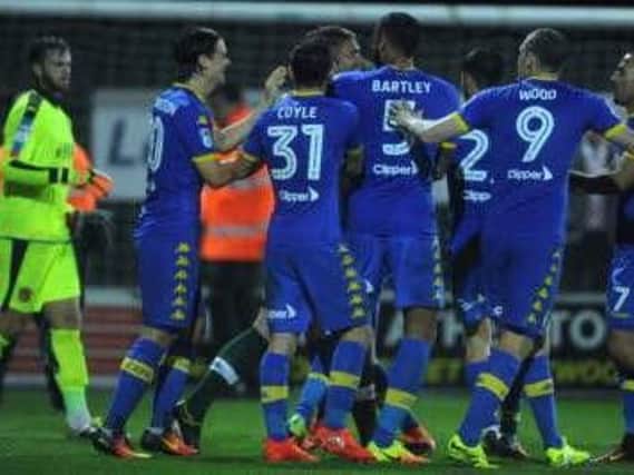 Leeds United's players mob Rob Green after his penalty save last night.